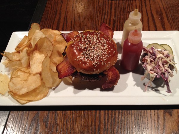 Hamburger - house-ground Slagel Farm beef, organic bacon, Carr Valley 4-year-aged cheddar, house-made pickle on a garlic-toasted sesame bun served with chips